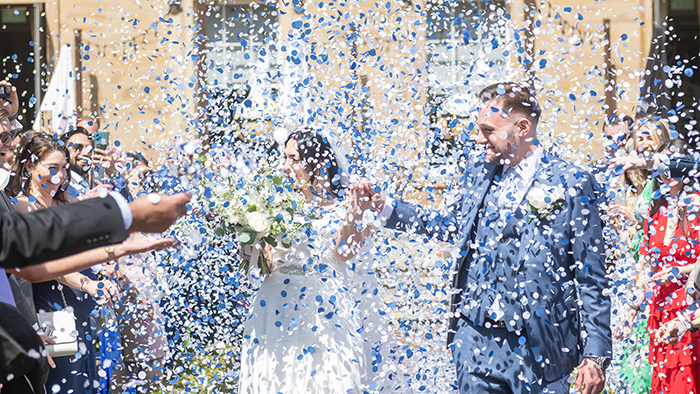 Confetti moment outside Oulton Hall with natural, candid photography.