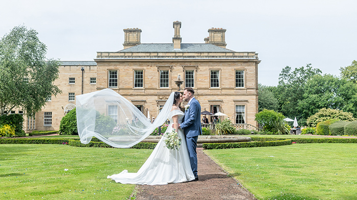 Relaxed couple portraits in the grounds of Oulton Hall.