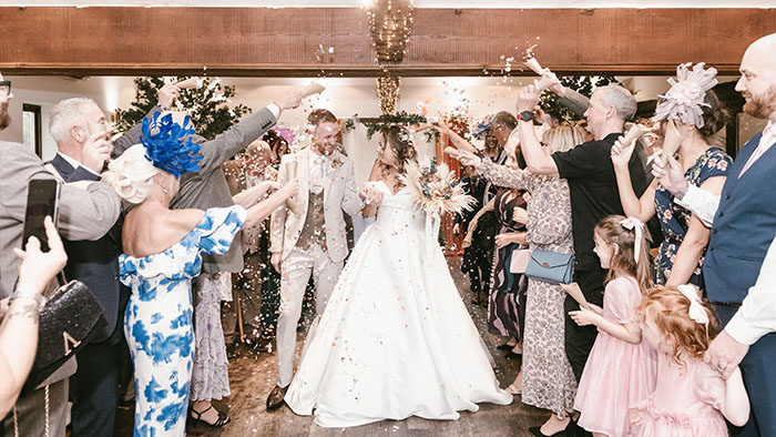 Indoor confetti throw at Tankersley Manor with the couple walking through.