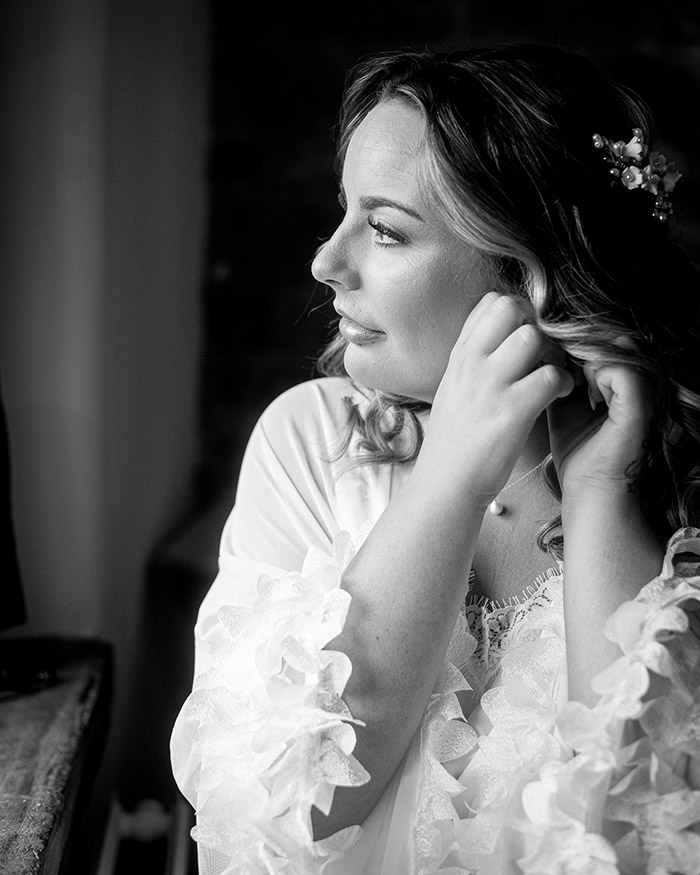 Bride getting ready at Tankersley Manor during morning preparations.