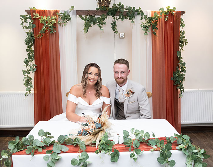 Bride and Groom signing the register at Tankersley Manor wedding ceremony