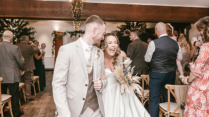 Bride and groom walking up the aisle at Tankersley Manor