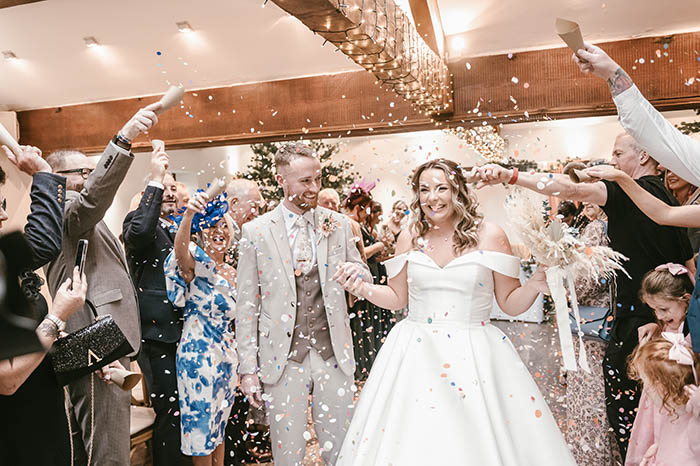 Joyful indoor confetti shot at Tankersley Manor wedding in Barnsley.