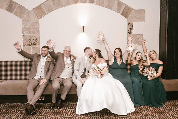 Full bridal party portrait inside Tankersley Manor wedding venue.