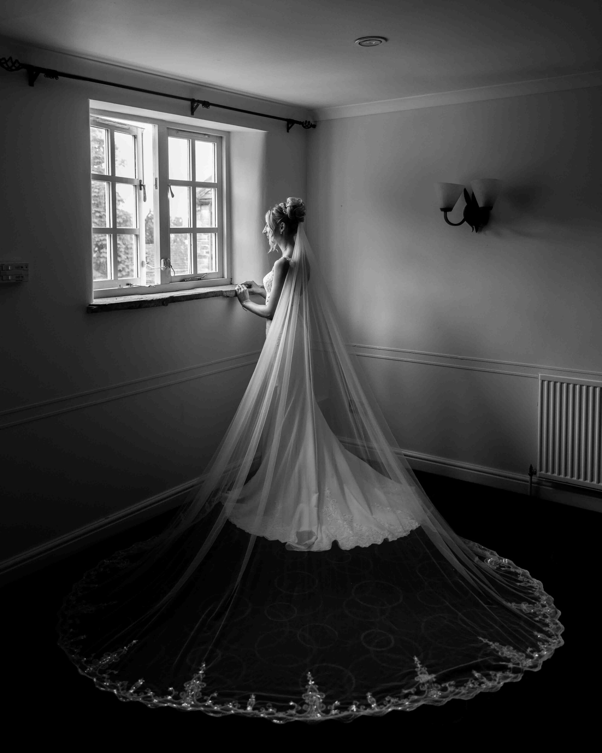 Bride on her own in preparations at Tankersley Manor