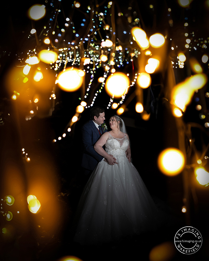 bride and groom surrounded by candlelight at Tankersley Manor