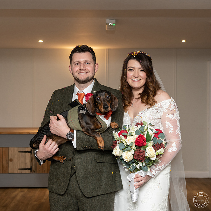 bride and groom holding their dog at Tankersley Manor