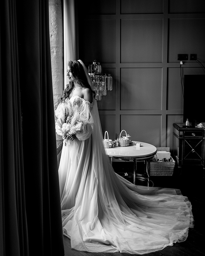 bride in the window at The Venue Bowers Mill