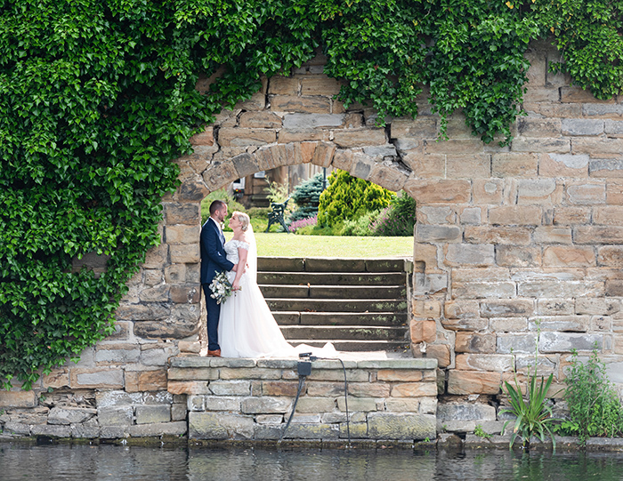 Couple portraits by the lake at Waterton Park Hotel
