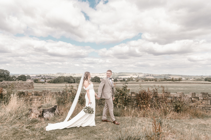 Relaxed moment of the couple walking through the grounds