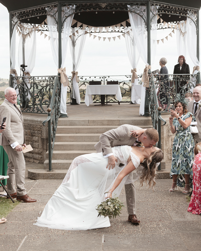 bride and groom dip kiss at Cubley Hall
