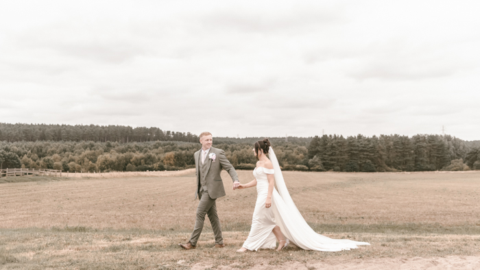 Bride and groom portraits in the fields at Inkersall Grange Farm