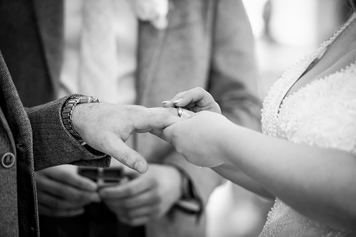 bride and groom exchanging rings at Whitley Hall