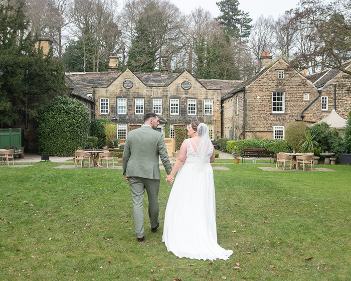 Relaxed moment of the couple walking through the grounds