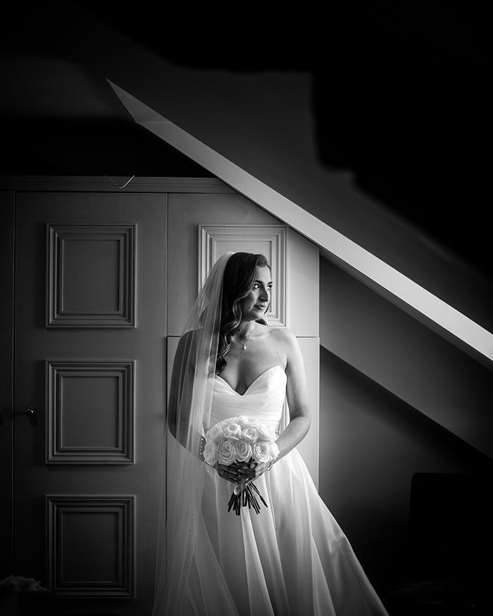 bride looking out of a window at hotel du vin harrogate
