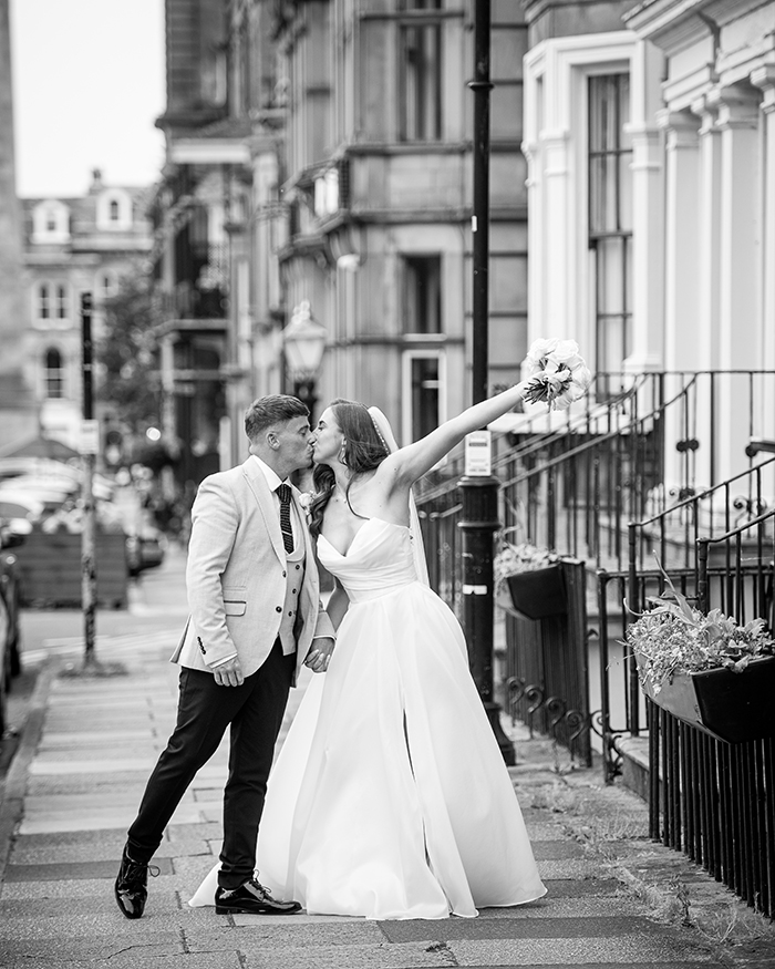 bride and groom walking on the street in harrogate