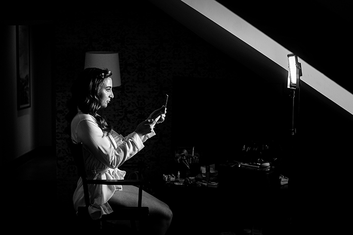 bride looking in a mirror in bridal preparations at hotel du vin harrogate